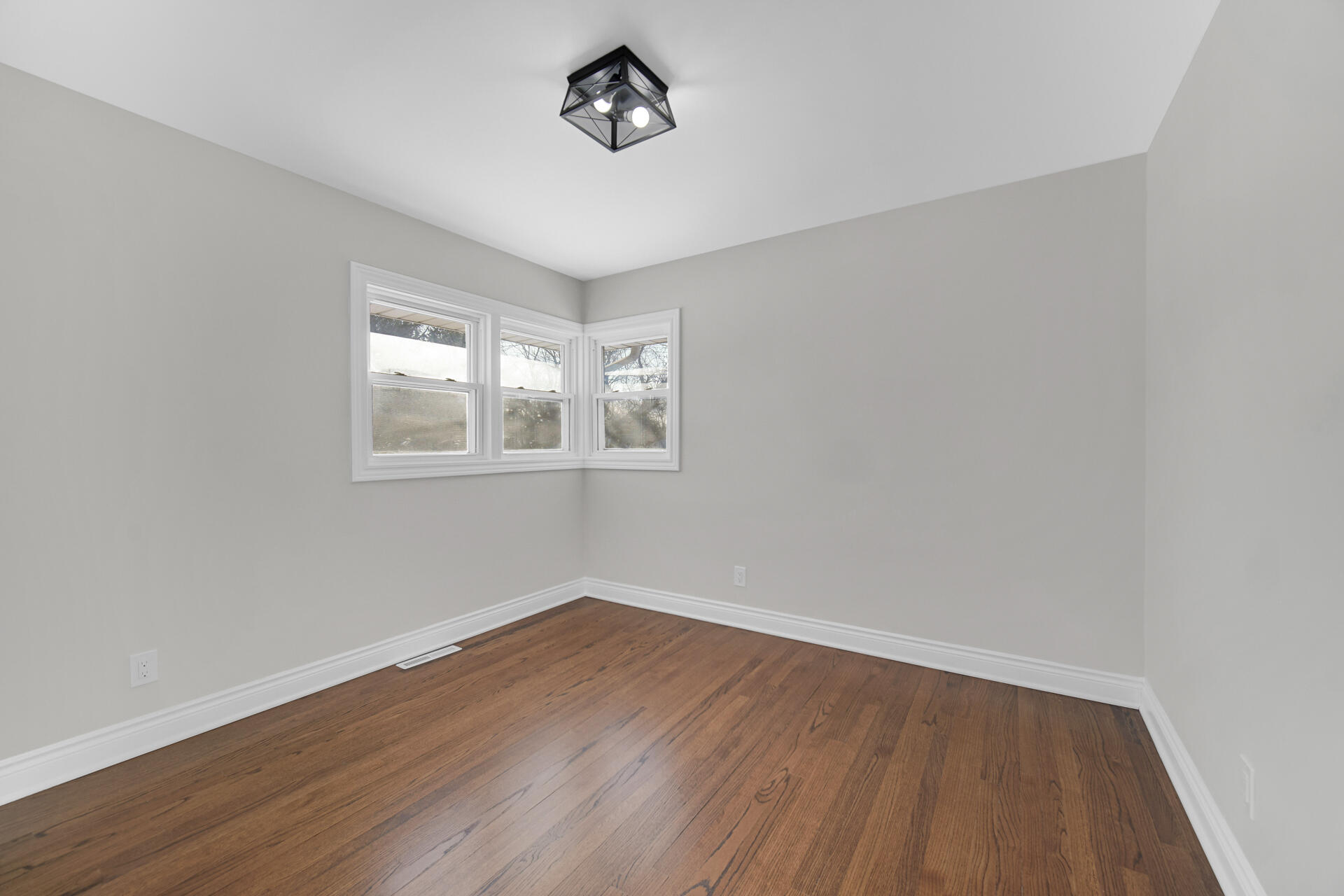 910 High Street Hobart, IN 46342 - Photo 15 of 29 wooden floor in an empty room with a window