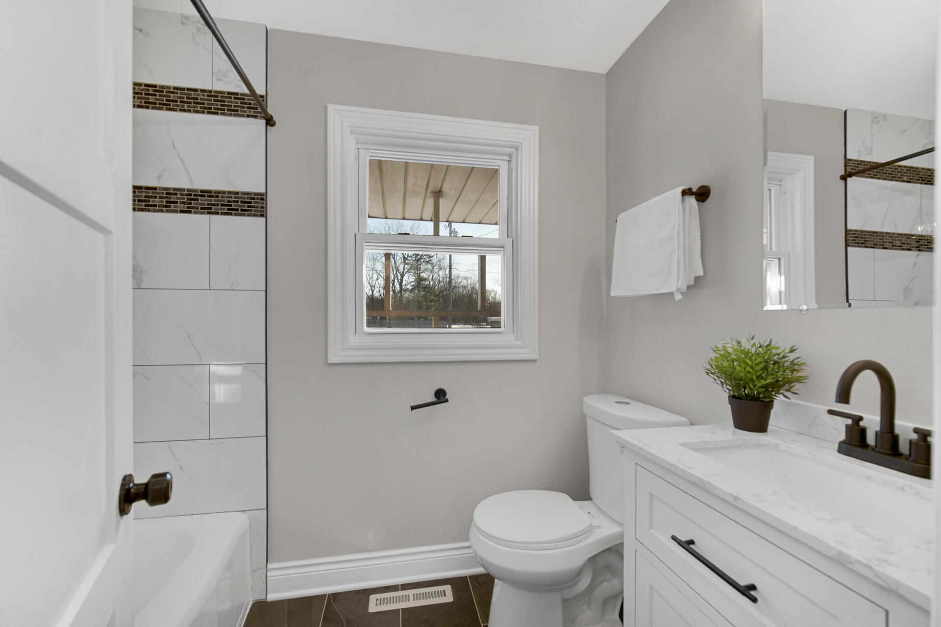 910 High Street Hobart, IN 46342 - Photo 16 of 29 a bathroom with a sink toilet and shower