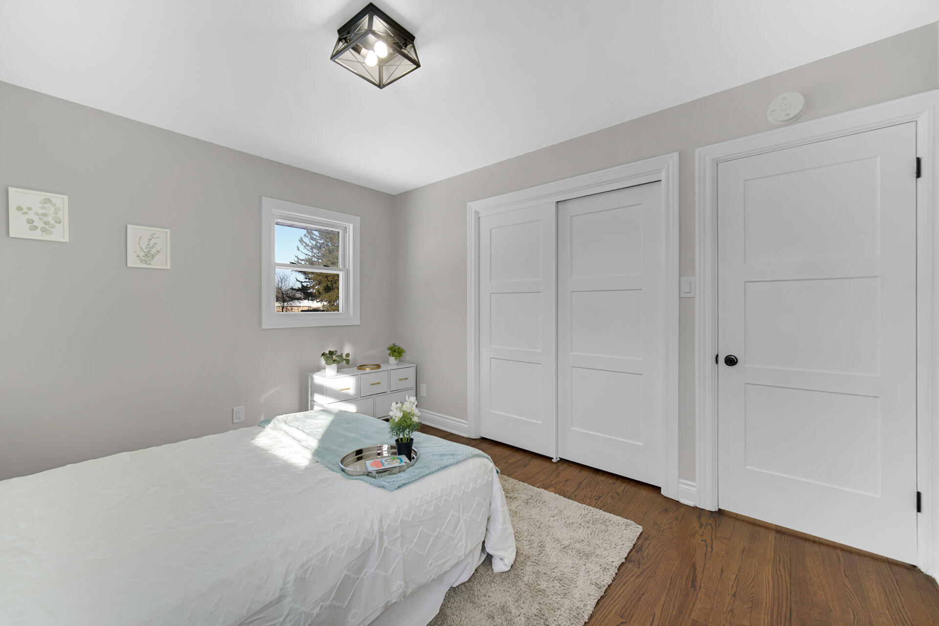 910 High Street Hobart, IN 46342 - Photo 18 of 29 a bedroom with a bed and wooden floor