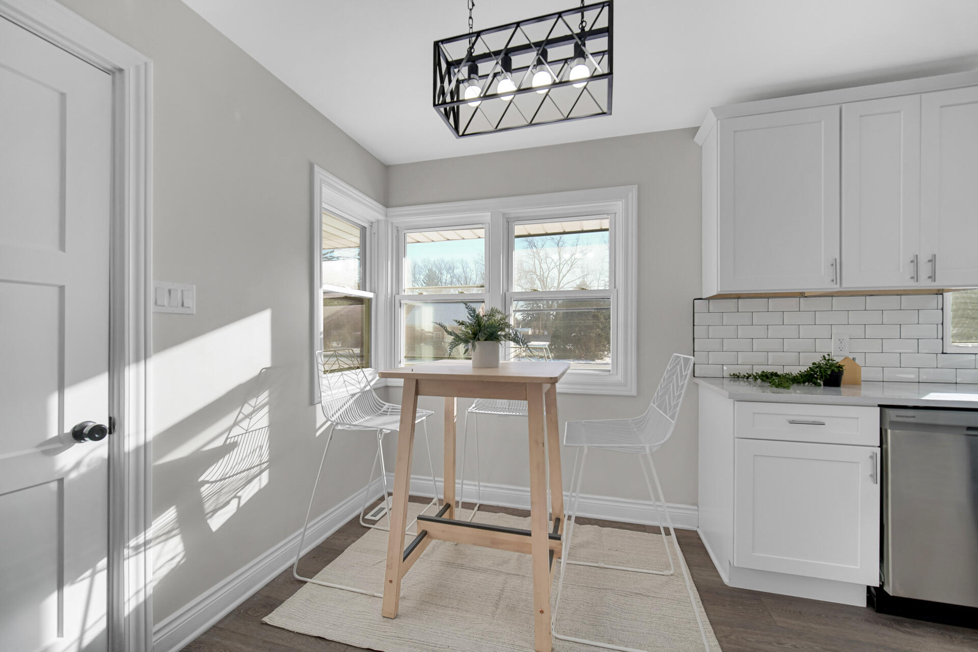 910 High Street Hobart, IN 46342 - Photo 9 of 29 a kitchen with white cabinets and window
