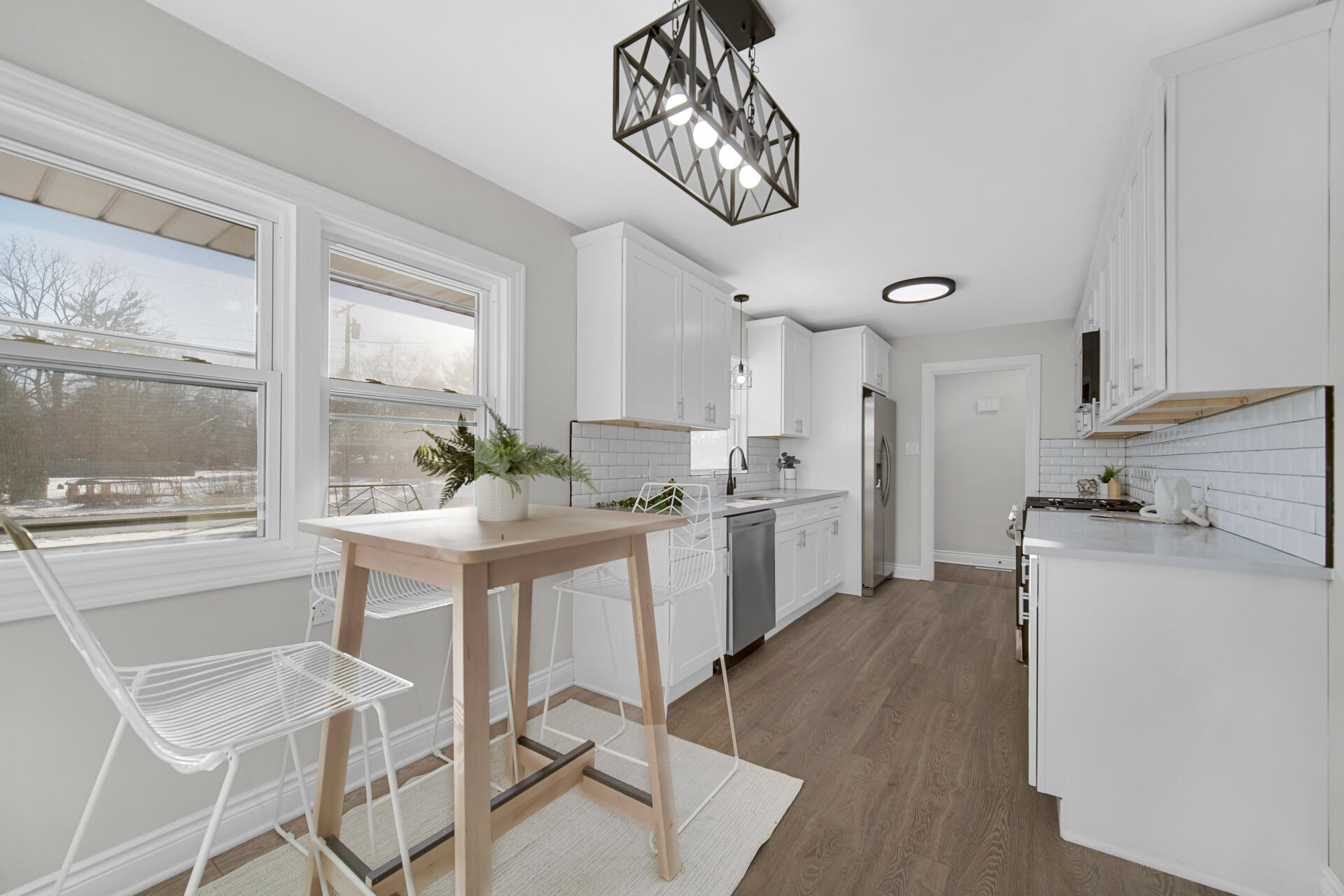910 High Street Hobart, IN 46342 - Photo 10 of 29 a kitchen with a sink a counter top space and appliances