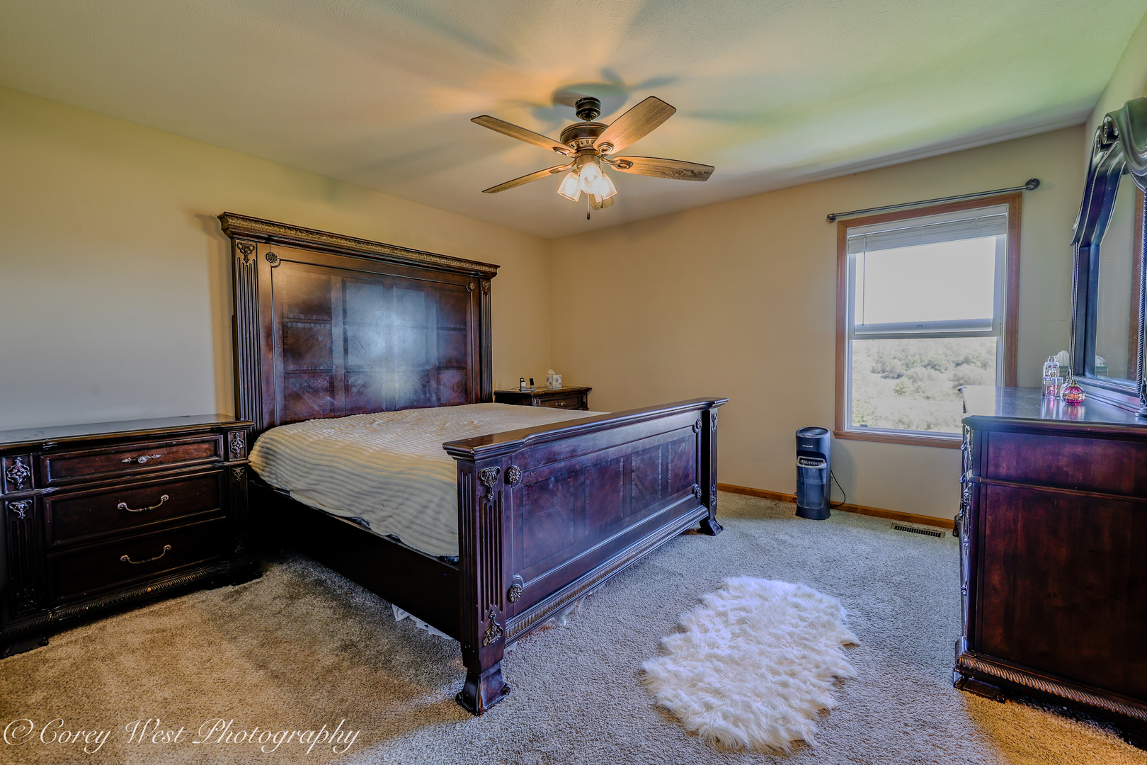 8453 Crooked Bend Road Machesney Park, IL 61115 - Photo 13 of 27 a bedroom with a bed and a mirror on dresser