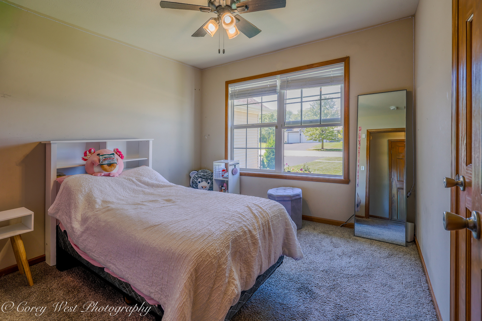 8453 Crooked Bend Road Machesney Park, IL 61115 - Photo 17 of 27 a bed sitting in a bedroom next to a window