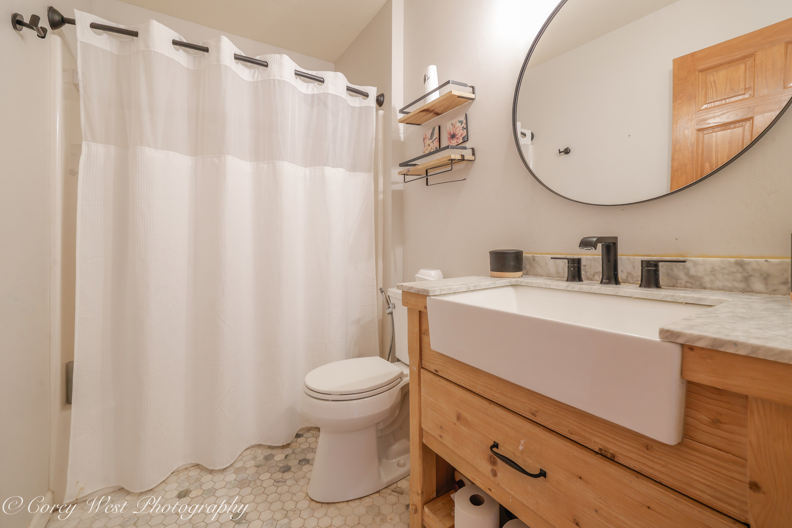 8453 Crooked Bend Road Machesney Park, IL 61115 - Photo 18 of 27 a bathroom with a sink a toilet and a mirror
