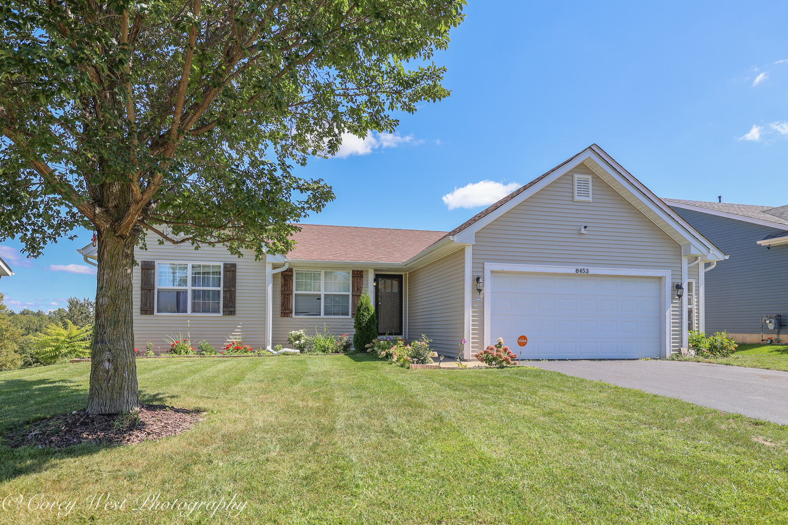 8453 Crooked Bend Road Machesney Park, IL 61115 - Photo 2 of 27 a front view of house with yard and trees in the background
