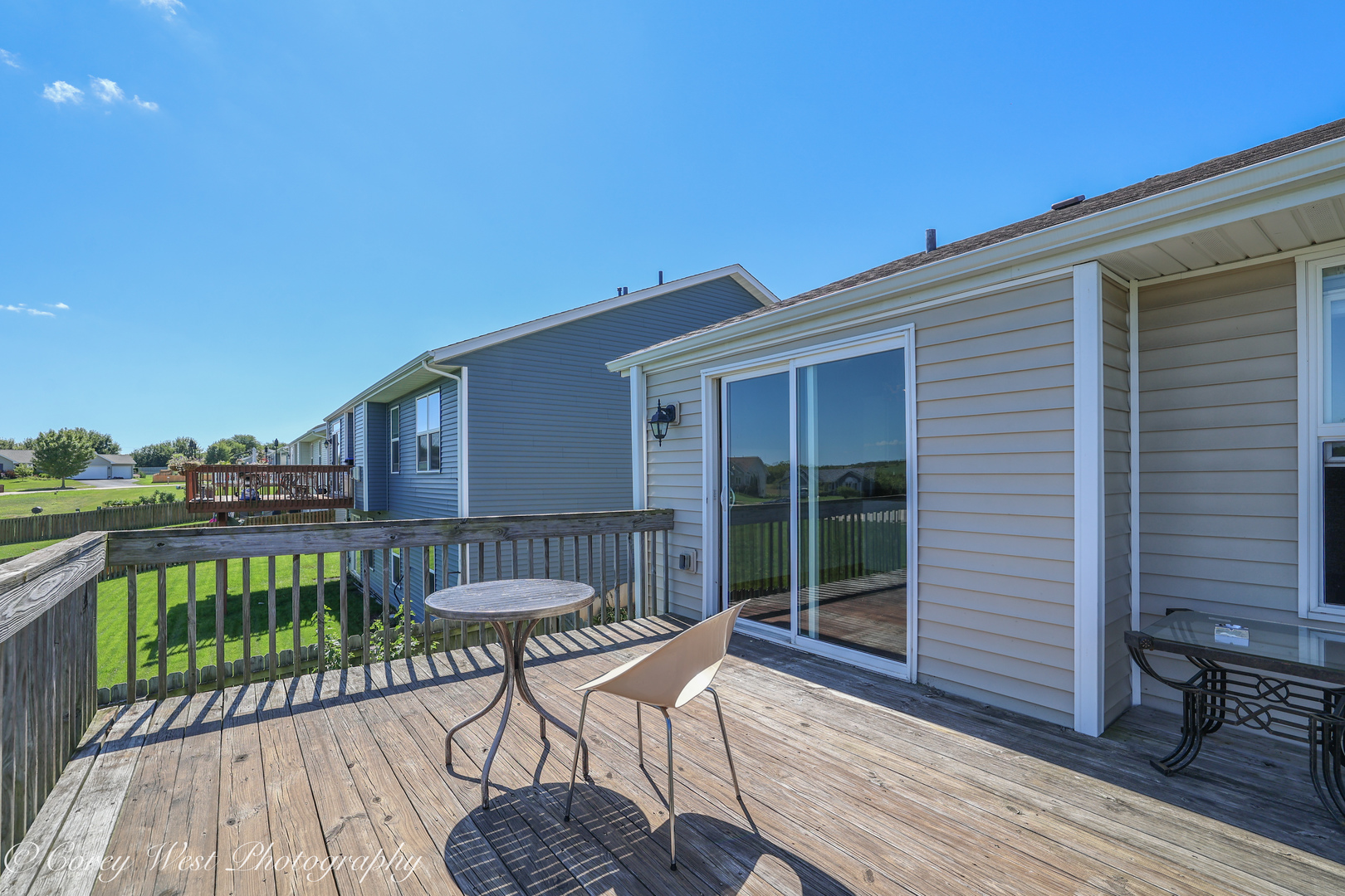 8453 Crooked Bend Road Machesney Park, IL 61115 - Photo 22 of 27 a view of a chair and tables in the balcony