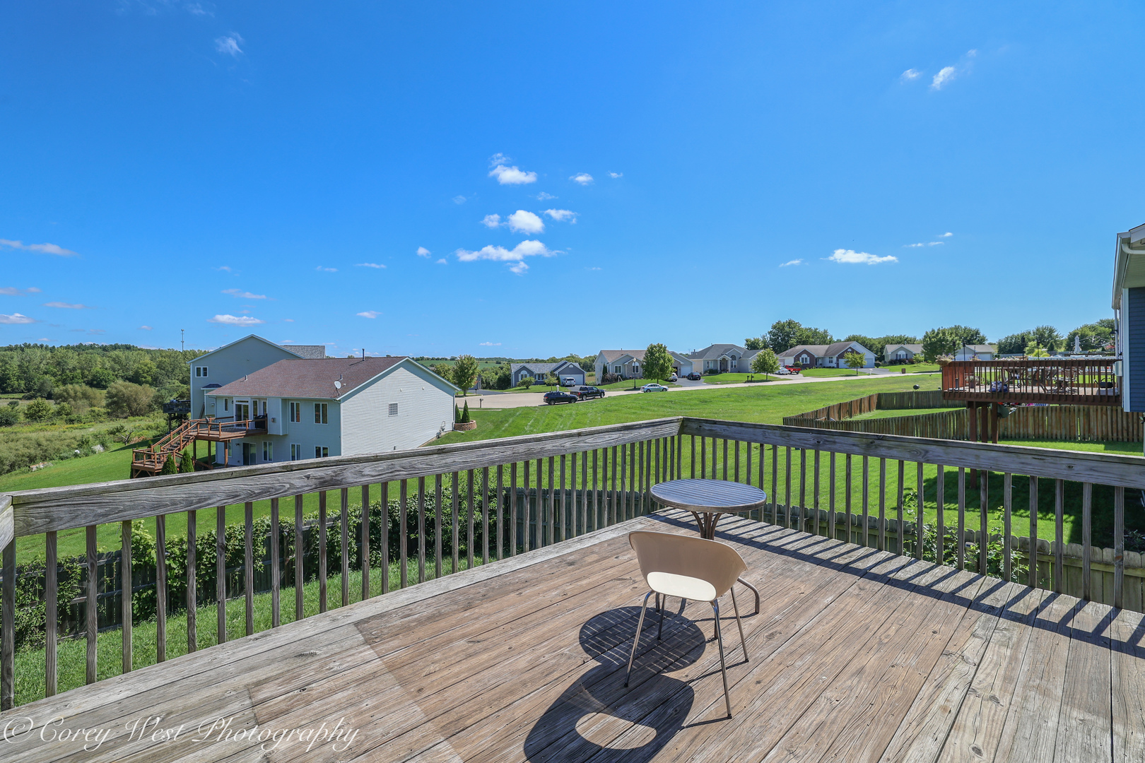 8453 Crooked Bend Road Machesney Park, IL 61115 - Photo 23 of 27 a view of a wooden deck with a yard