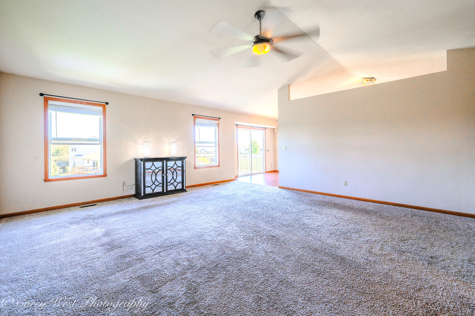 8453 Crooked Bend Road Machesney Park, IL 61115 - Photo 5 of 27 a view of an empty room with a window and fireplace