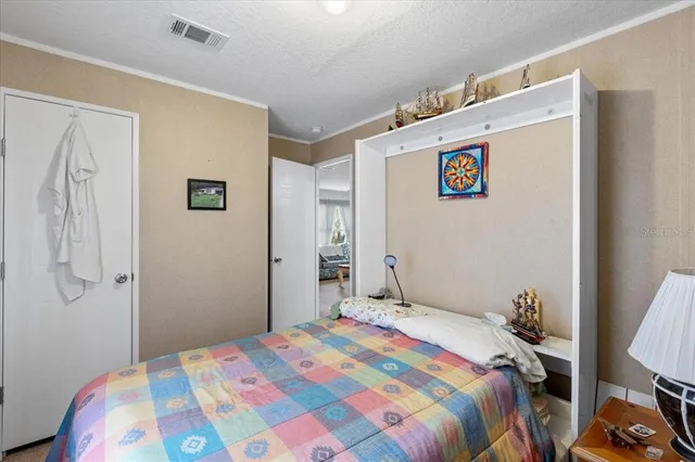 a bedroom with a bed and a closet