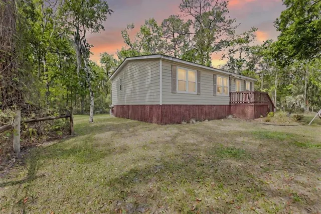 a house with trees in the background