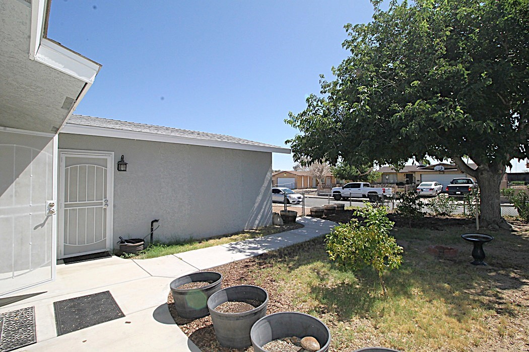 308 Muir Street Barstow, CA 92311 - Photo 27 of 27 a backyard of a house with yard and outdoor seating