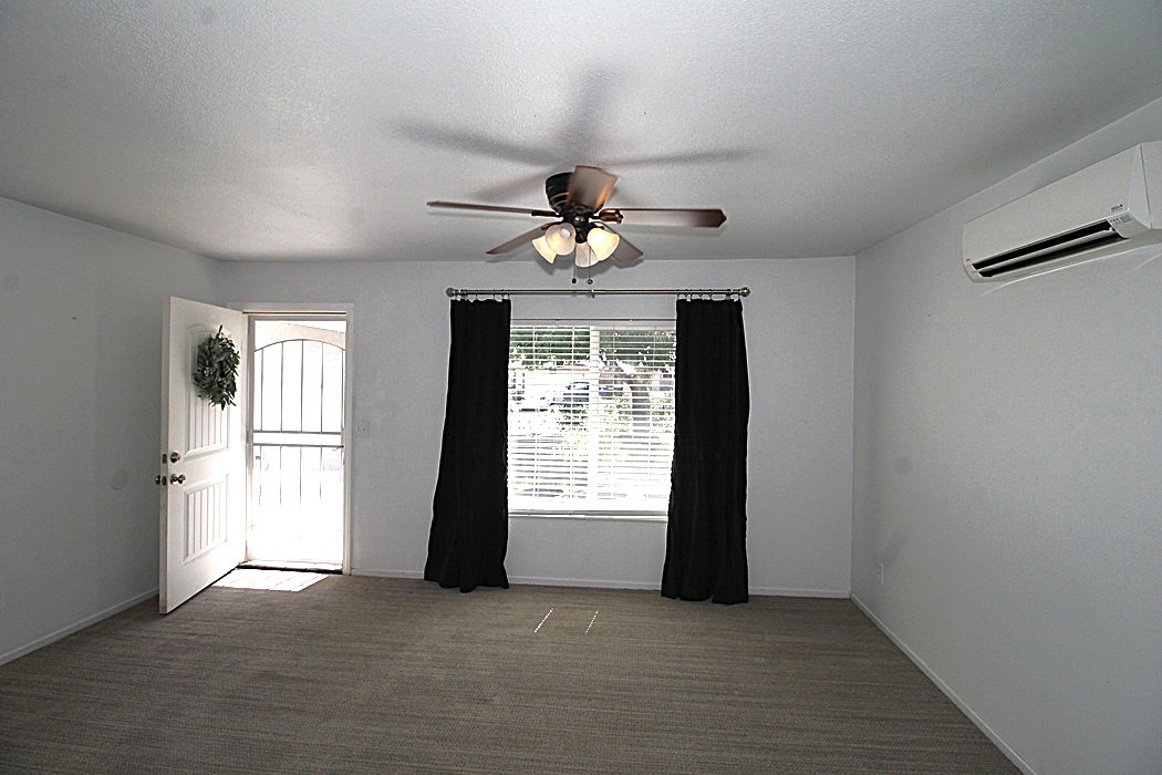 308 Muir Street Barstow, CA 92311 - Photo 5 of 27 a view of an empty room with a window