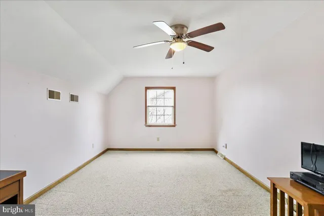 a view of backyard of house and trees
