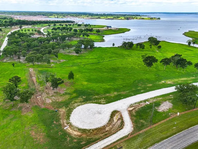 a view of a lake with a yard