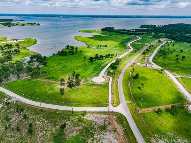 a view of a swimming pool with a yard