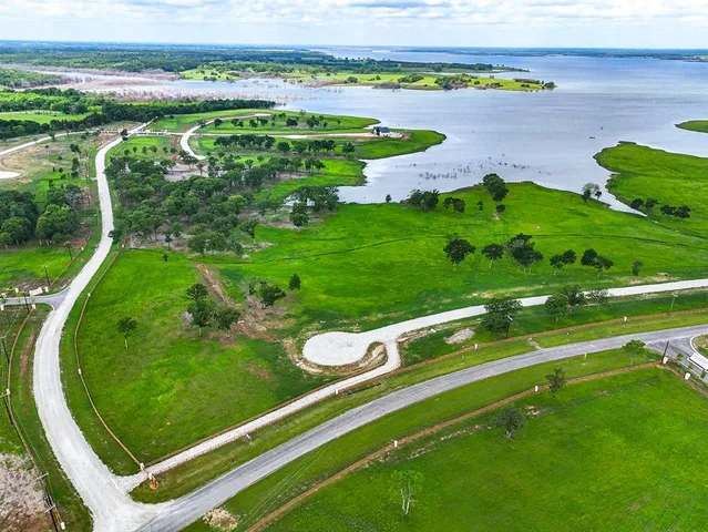 a view of a golf course with a lake view