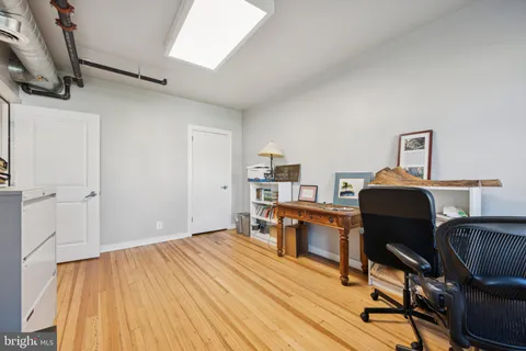 a workspace with furniture hardwood and a window