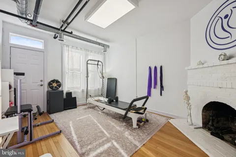 a view of a livingroom with furniture and a fireplace