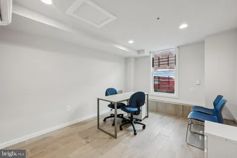 a workspace with furniture and a window