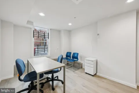 a view of a dining room with furniture and window