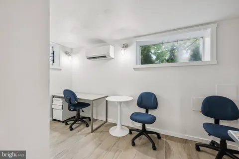 a work room with furniture and a window