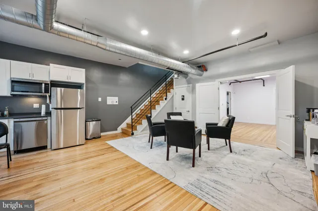 a outdoor space with lots of furniture and wooden floor