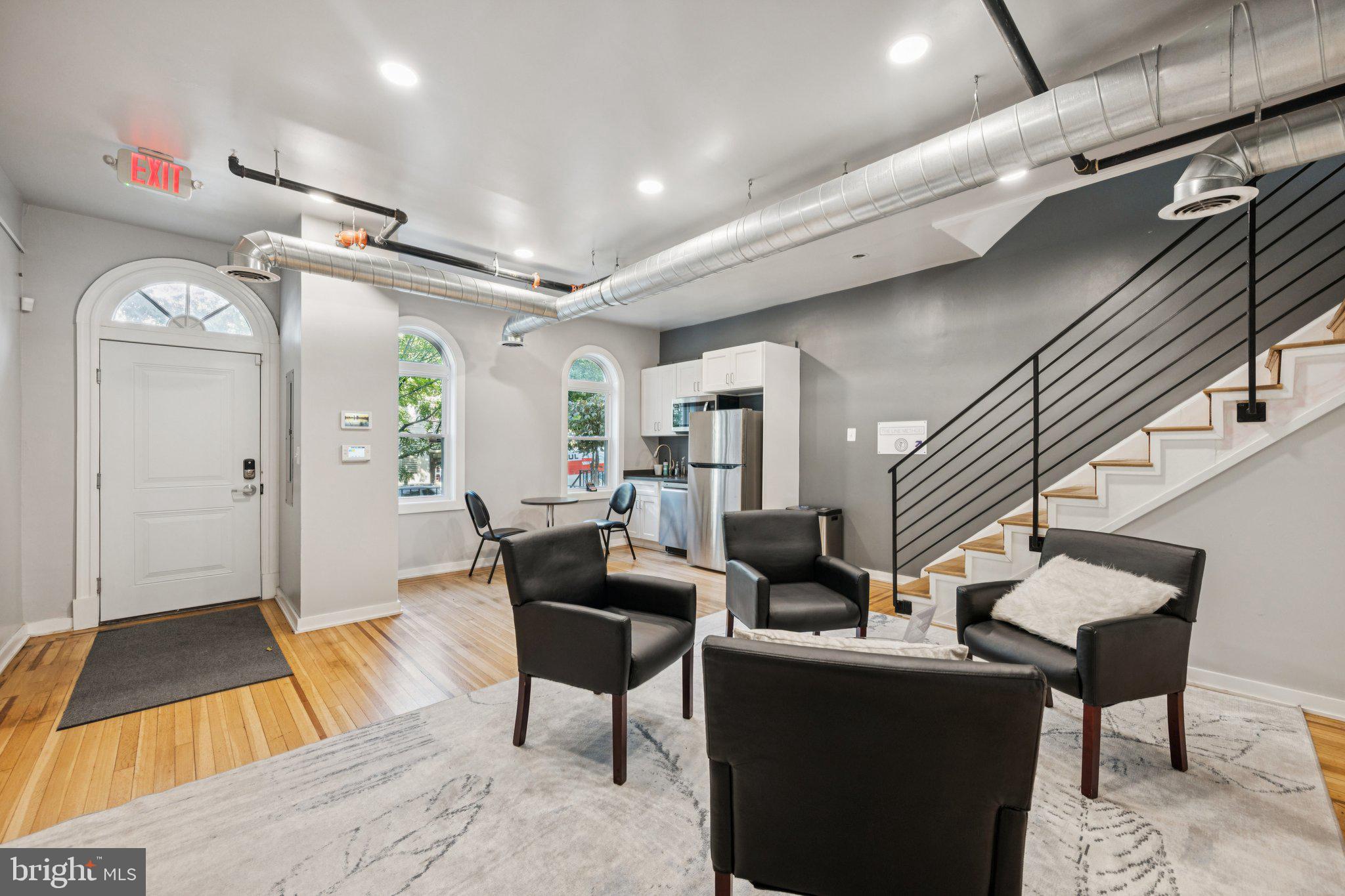 2708 Ontario Road Northwest Washington, DC 20009 - Photo 5 of 31 a living room with furniture and a wooden floor