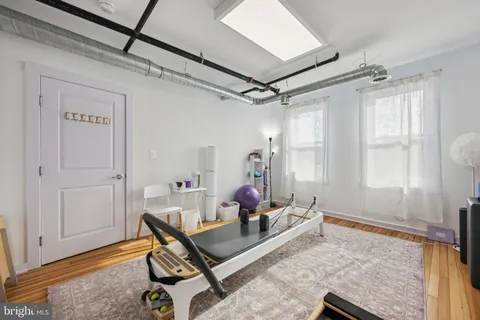 a room with furniture and wooden floor