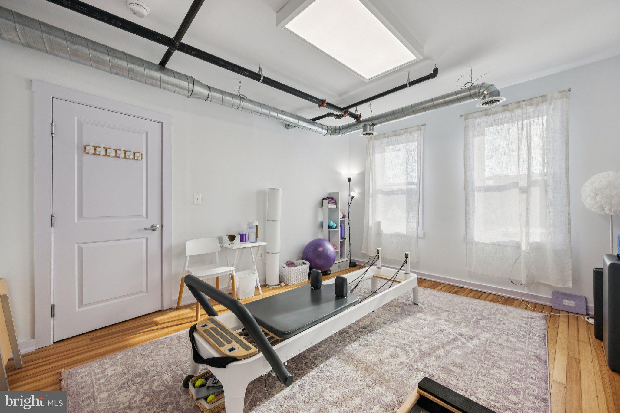 2708 Ontario Road Northwest Washington, DC 20009 - Photo 10 of 31 a room with furniture and wooden floor