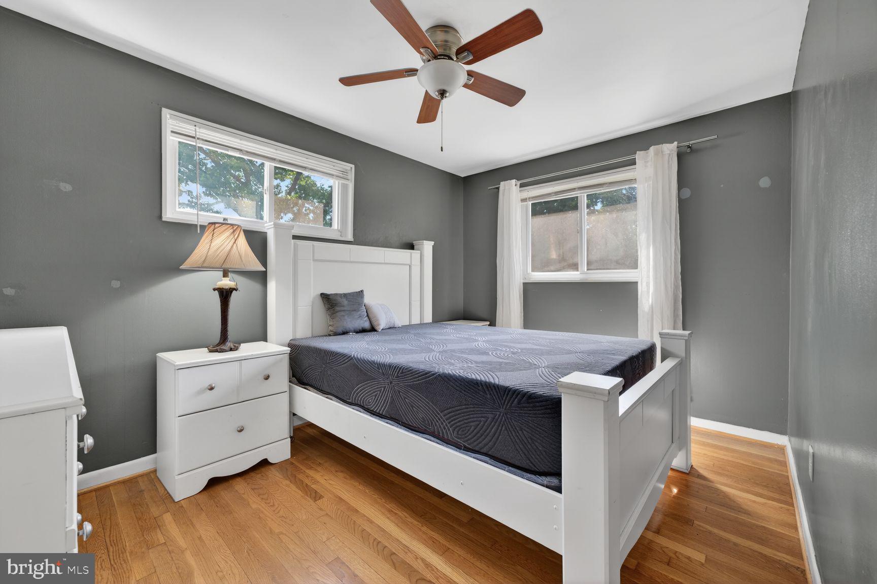 1104 Caddington Avenue Silver Spring, MD 20901 - Photo 19 of 35 a bedroom with a bed and a chandelier