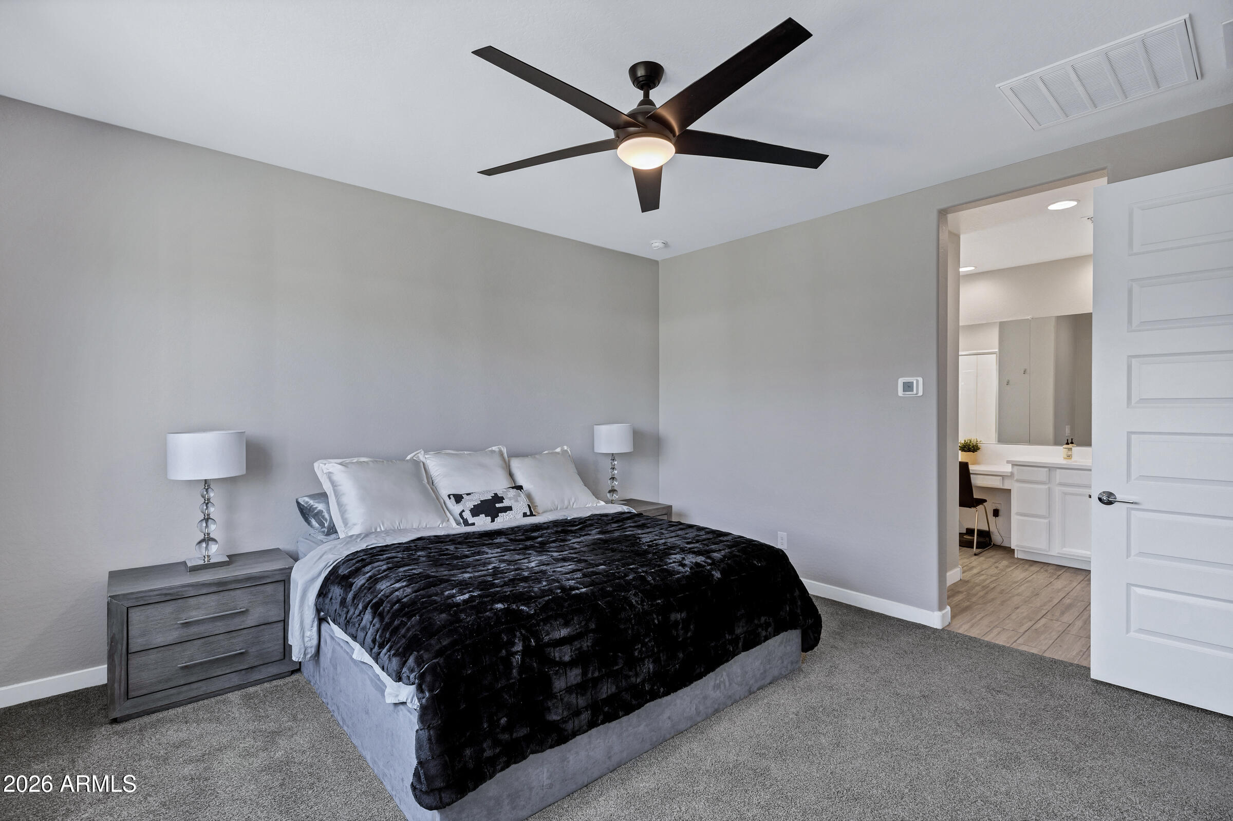 12243 East Sereno Road Gold Canyon, AZ 85118 - Photo 18 of 37 a bedroom with a bed and cabinets