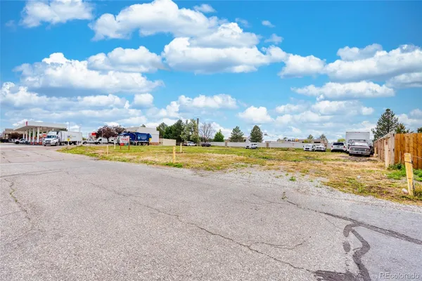 a view of a swimming pool and an outdoor seating