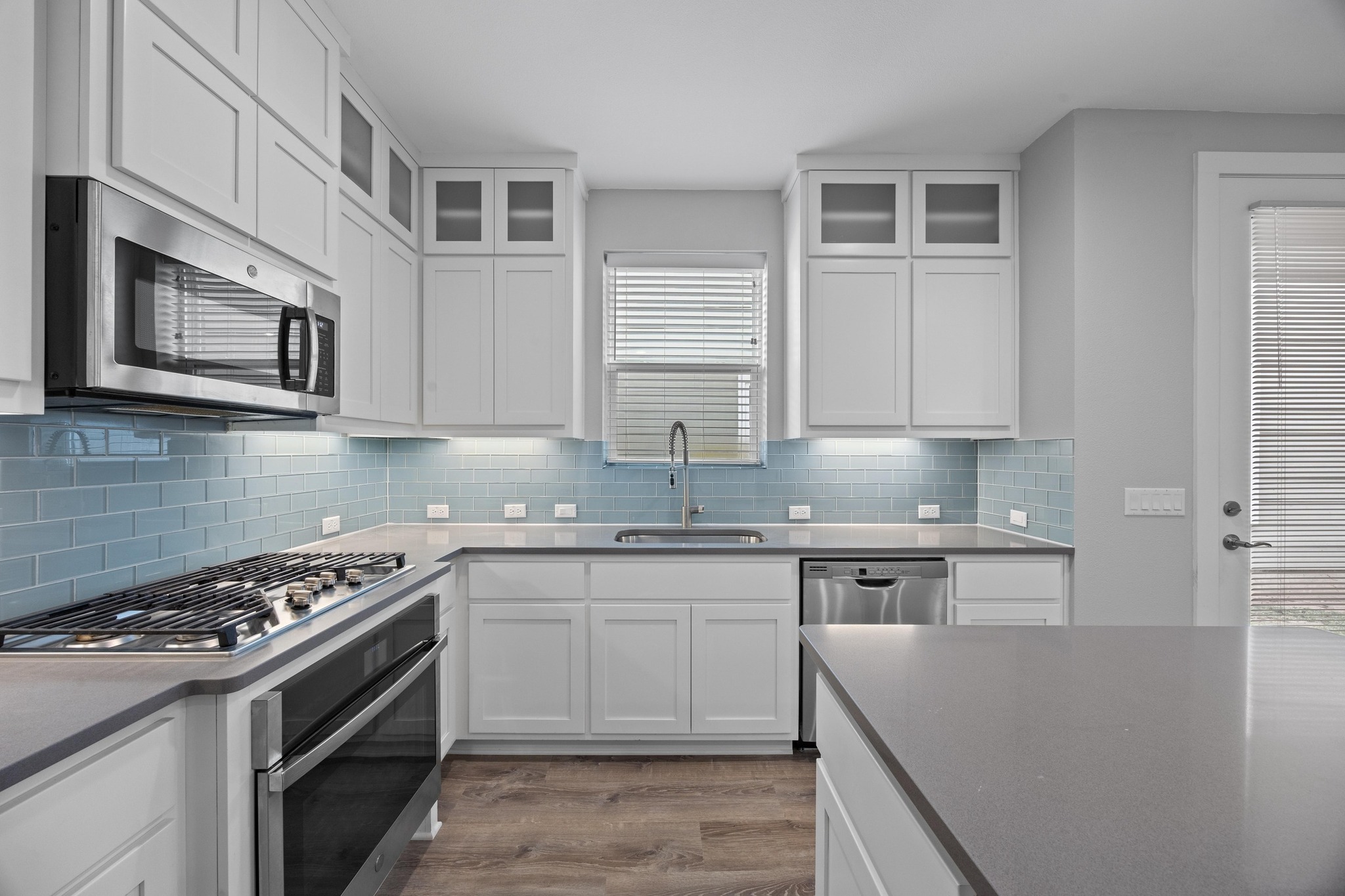 2222 Simond Avenue, Unit E Austin, TX 78723 - Photo 9 of 28 Gas range and a window over the kitchen sink.