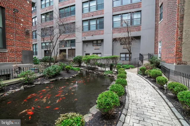 a front view of a building with garden