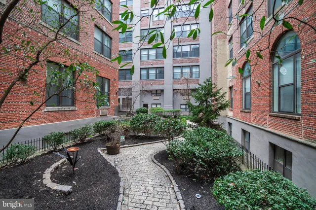 a view of a building with a garden