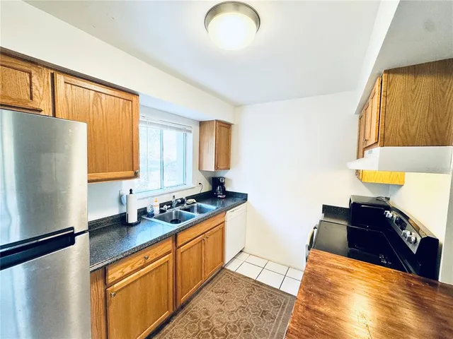 a spacious bedroom with a bed and a window