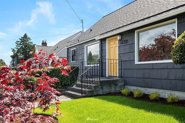 a front view of a house with a yard and fountain