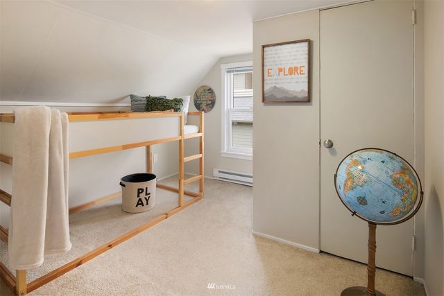 a view of dining room with a table and chairs