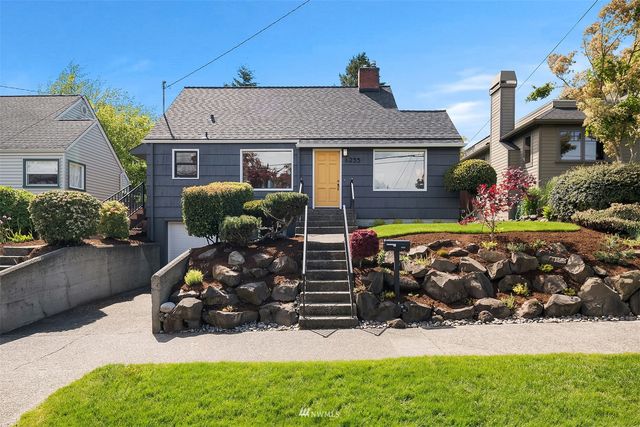 a front view of a house with yard