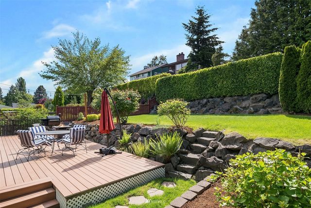 a view of a chairs and table in the patio
