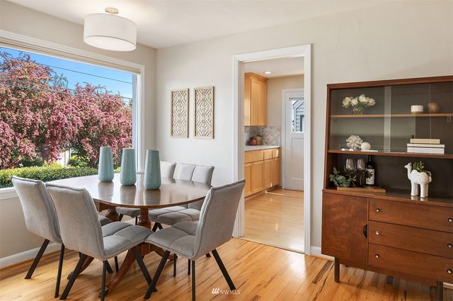 a view of a dining room with furniture and window
