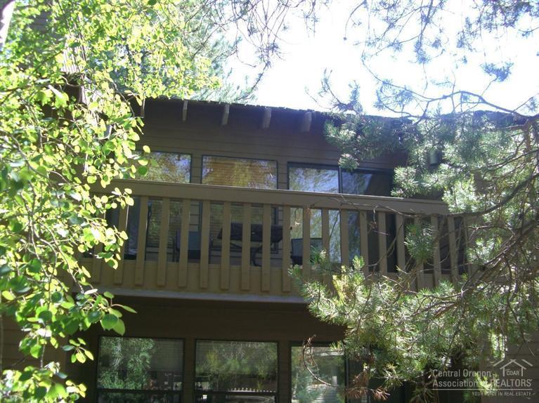 57395 Beaver Ridge Loop, Unit 40 A1 Sunriver, OR 97707 - Photo 19 of 25 front view of house with a garden