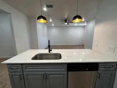 a kitchen with stainless steel appliances a stove microwave and refrigerator
