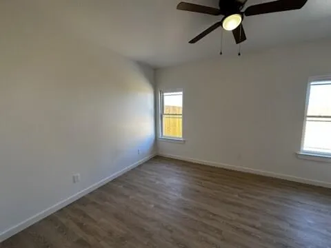a view of a hallway with a wooden cabinets