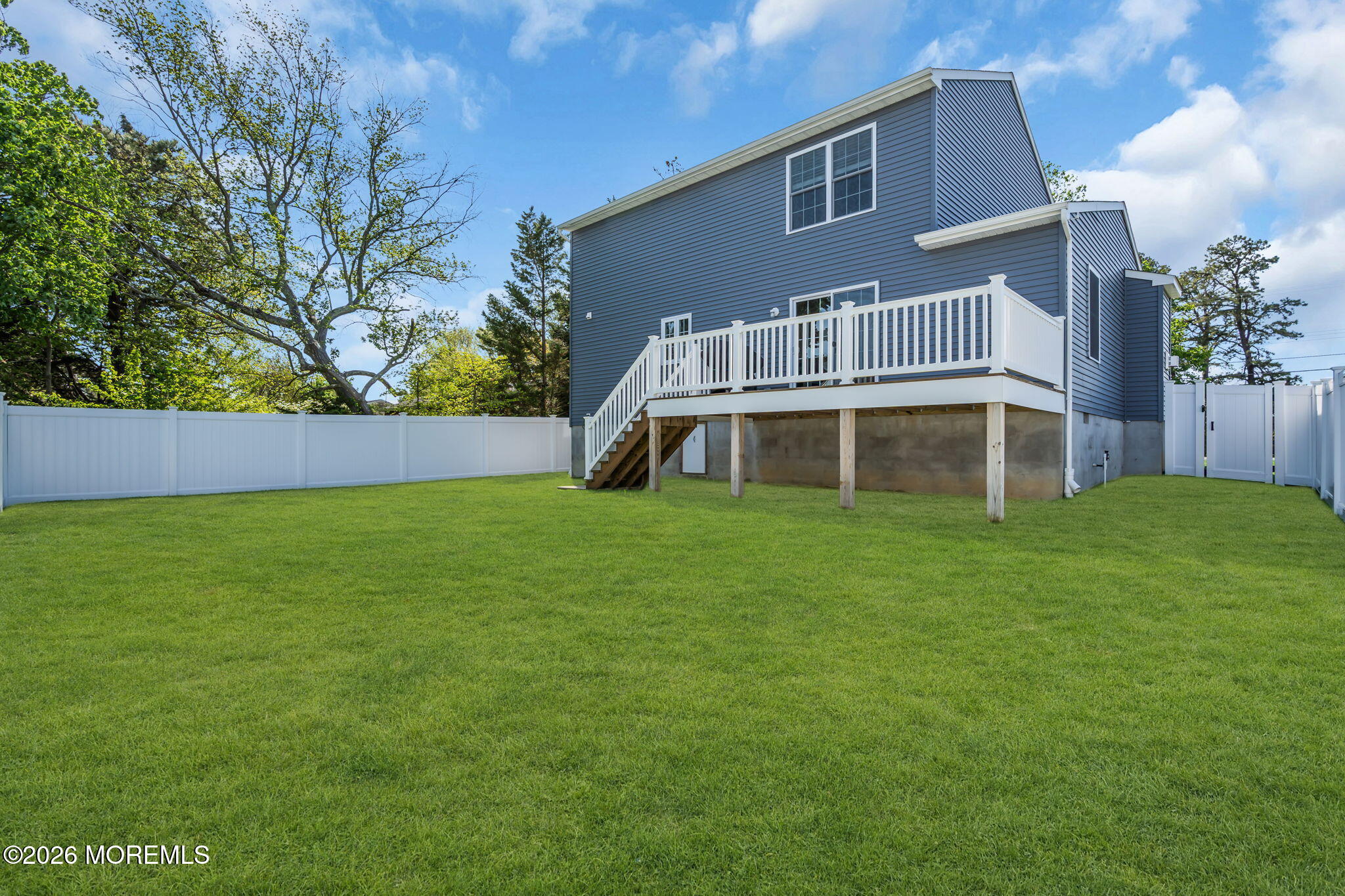 312 Beach Boulevard Forked River, NJ 08731 - Photo 35 of 40 a front view of a house with a yard