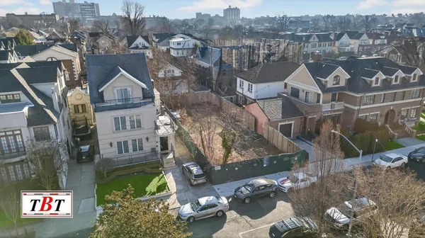 an aerial view of a house with a lake view