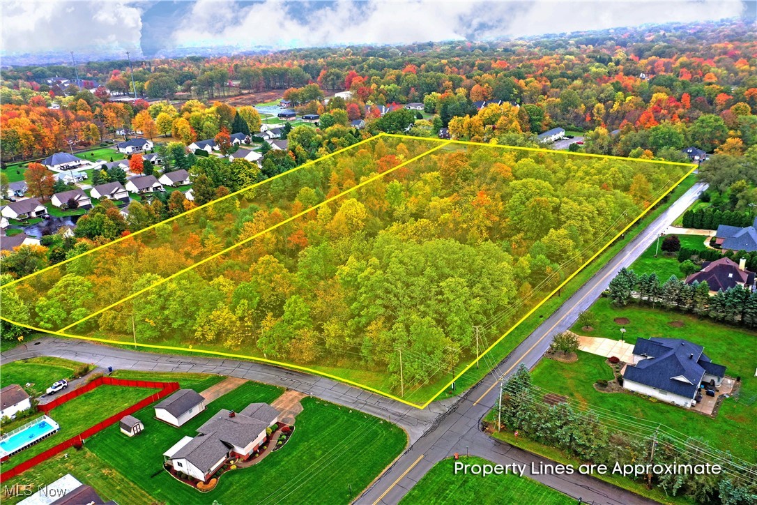 Hubbard Road Youngstown, OH 44505 - Photo 2 of 13 Aerial view of residential area featuring a forest and property parcel outlined