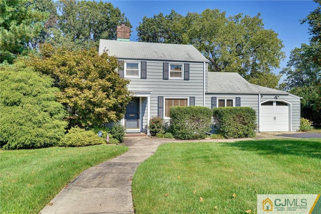 15 Carpender Road New Brunswick, NJ 08901 - Photo 1 of 25 a front view of a house with a yard and trees