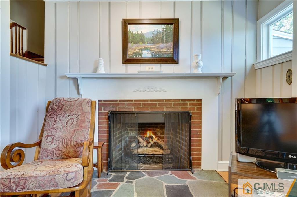 15 Carpender Road New Brunswick, NJ 08901 - Photo 13 of 25 a living room with furniture and a fireplace