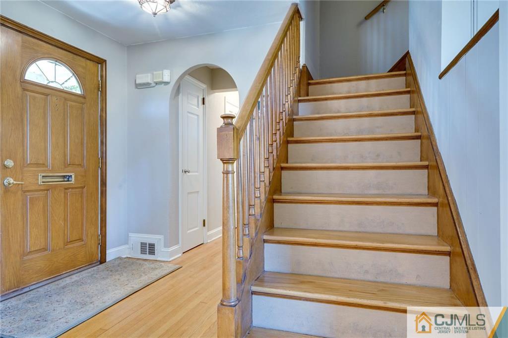 15 Carpender Road New Brunswick, NJ 08901 - Photo 15 of 25 a view of entryway and hall with wooden floor